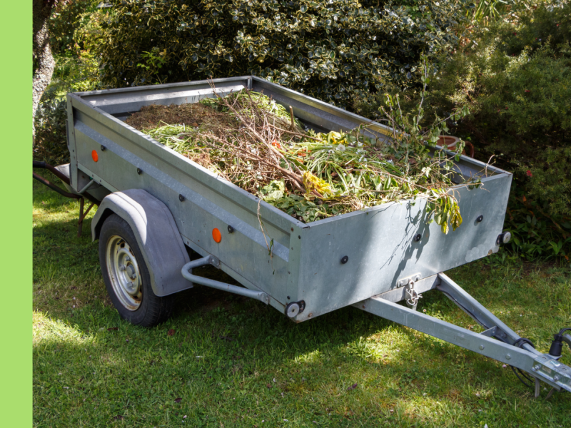 Green waste in a grey trailer 